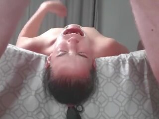 Upside down piss loving escort laying face down from bed swallows piss in two non identical camera angles