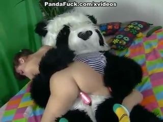 Sedusive brunette young female seducing Panda bear